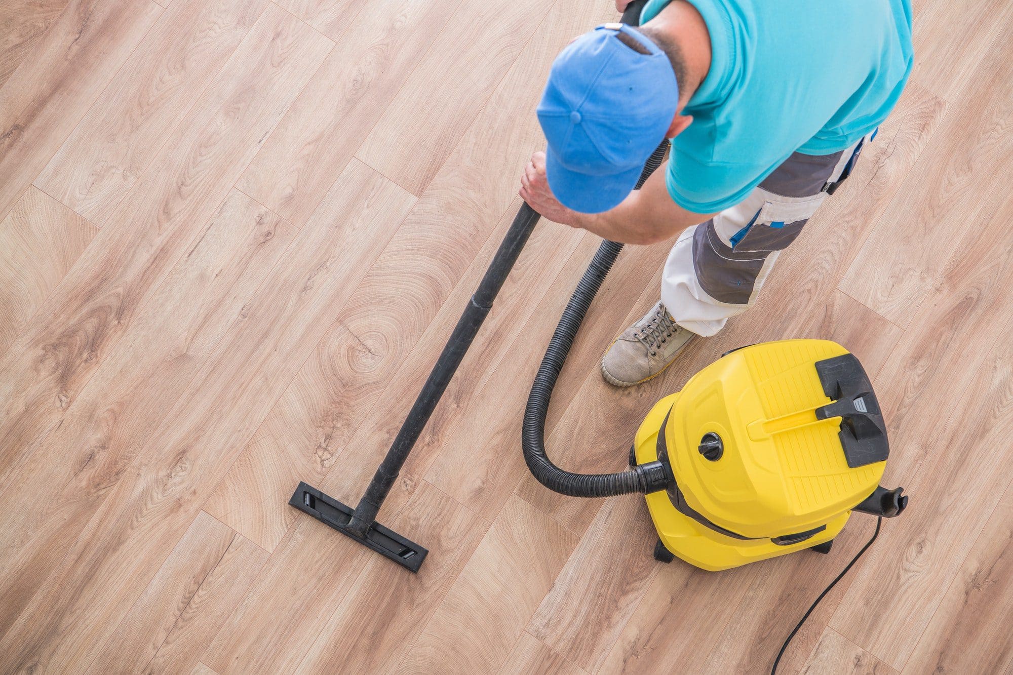 Best Tiles for Kitchen Floor: What to Use and What to Avoid 4 man hoovering floor